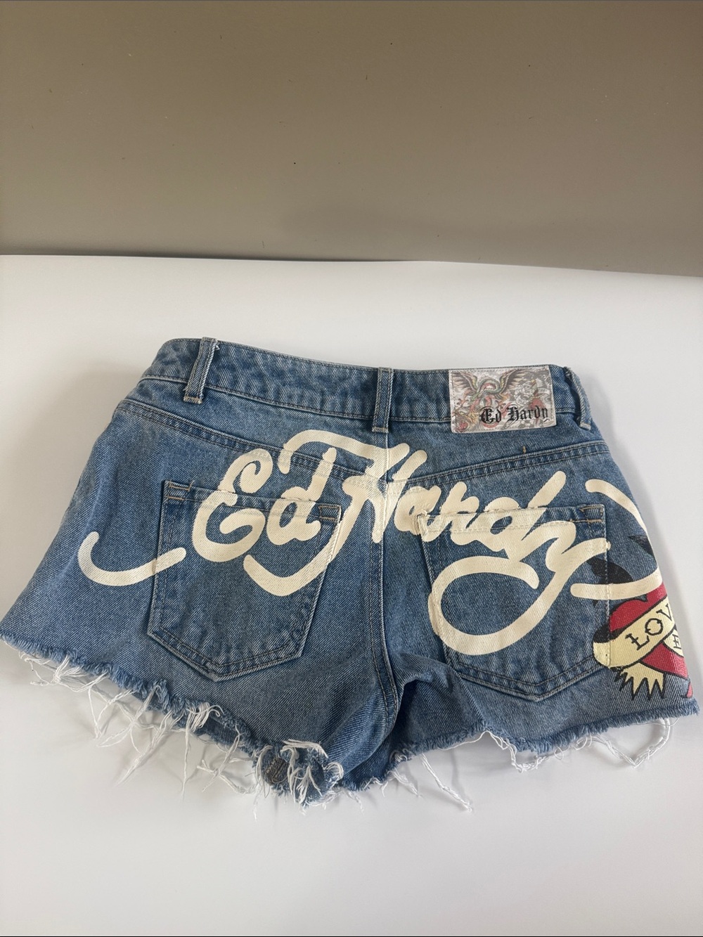 Ed Hardy Blue Denim Shorts with White Script and Red Accent